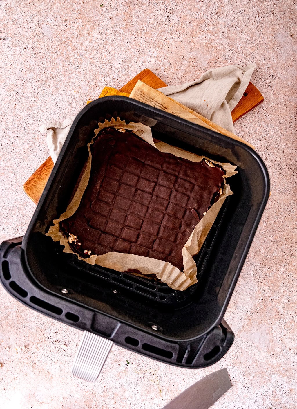 Puffed rice, chocolate from the hot air fryer and baking paper.