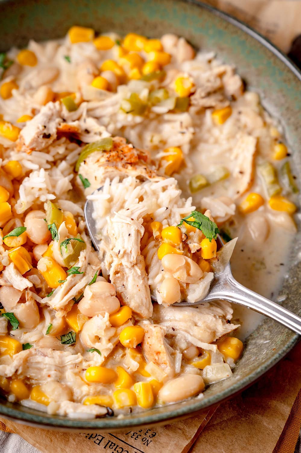 Fresh white chicken chili, corn and beans in a creamy sauce.