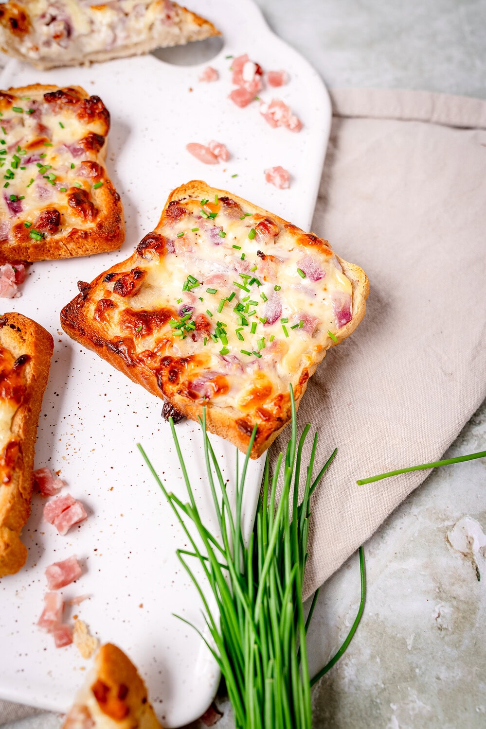 Delicious tarte flambée toast with bacon and onions