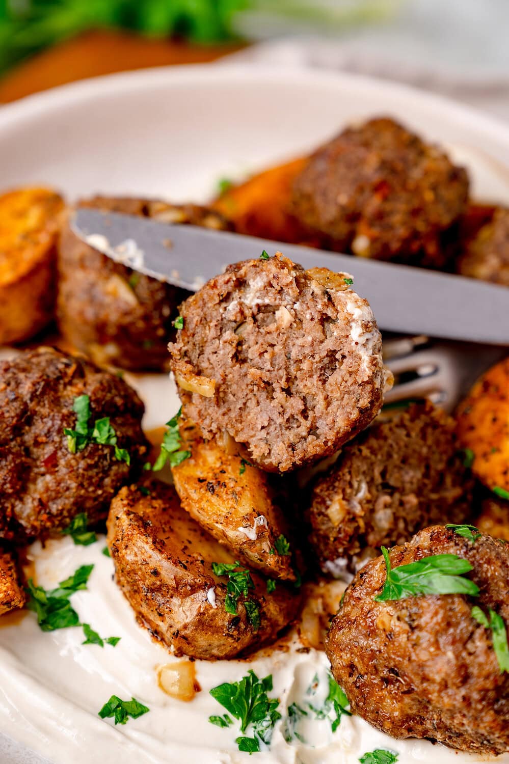 Köfte meatballs with baked potatoes