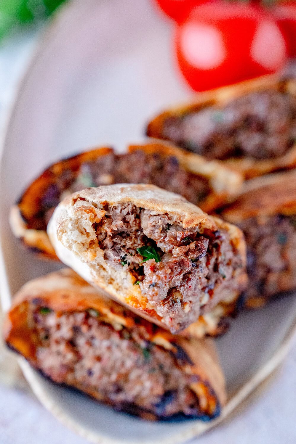 Half-bitten Arayes with a minced beef filling