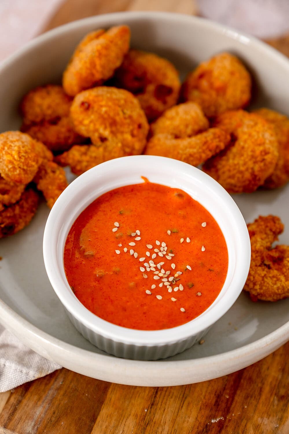 A delicious bowl full of Gochujang mayonnaise with some sesame