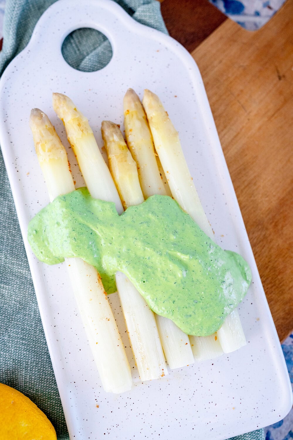 Green tartare sauce on a bed of asparagus 